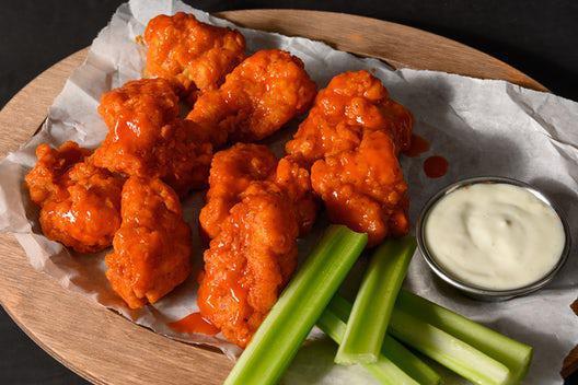 10 Boneless Wings · 10 breaded boneless wings made with breast meat with your choice of two flavors. Includes celery and your choice of ranch or blue cheese dressing.