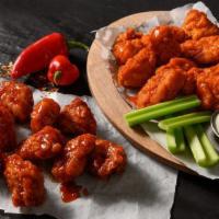 20 Boneless Wings · 20 breaded boneless wings made with breast meat with your choice of two flavors. Includes ce...