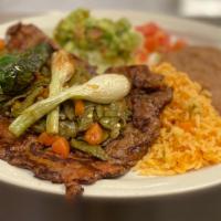Carne Asada Plate · Served with grilled cactus and pico de gallo, salad, guacamole, rice, beans and 3 tortillas.