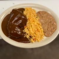 Pollo En Mole Plate · Chicken covered with mole. Served with rice and beans.