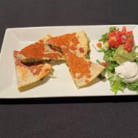 Two Cheese Quesadillas · Pepita pesto, caramelized onion rajas, jack cheese & choice of chicken, steak or spinach mus...