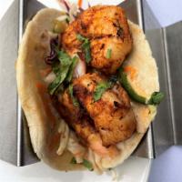 Grilled Rojo Shrimp Taco · Two Tacos – Grilled shrimp with crunchy slaw with ancho crema. Served with coconut lime rice...