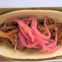 BBQ Pork Taco · Two tacos with pulled smoked pork with a pineapple habanero BBQ sauce topped with pickled re...