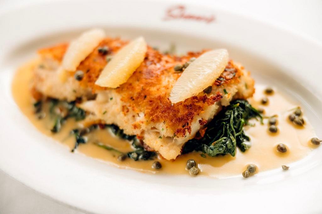 Parmesan Crusted George's Bank Haddock · Sautéed spinach, capers, and lemon butter.