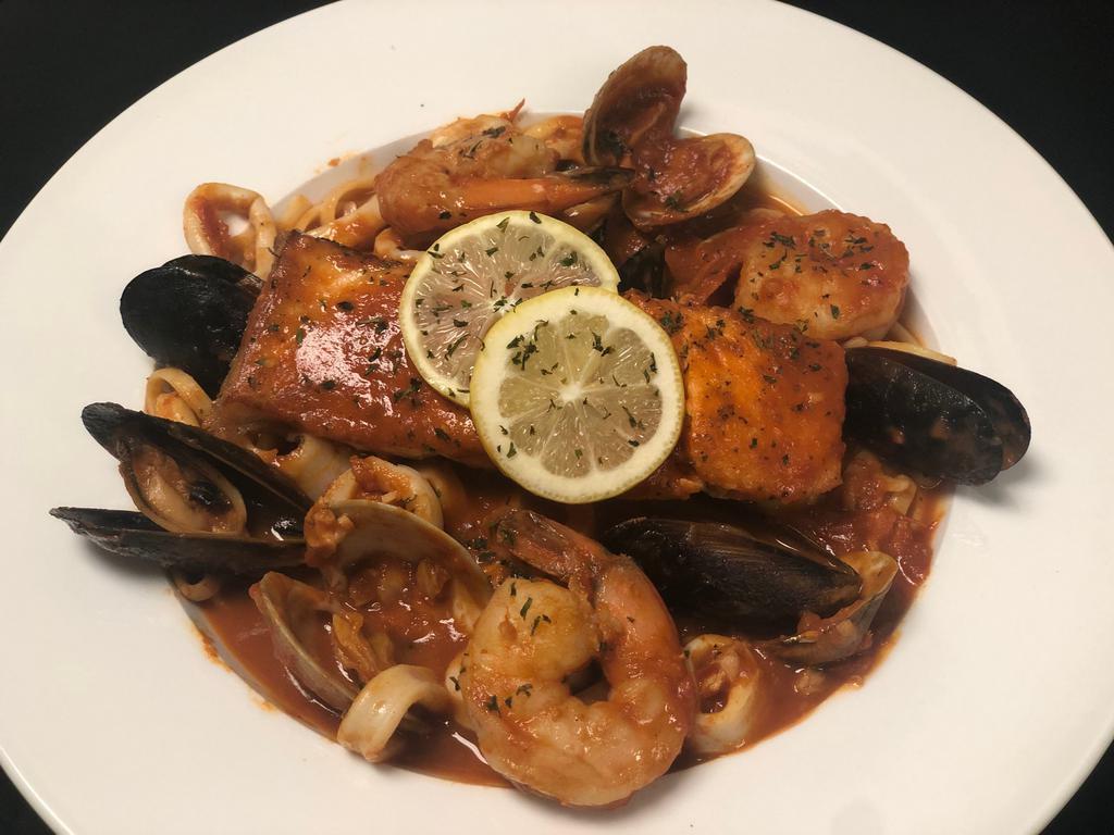 Zuppa di Pesce with Pasta · Flesh clams, mussels, calamari, shrimp, and salmon prepared in a special seafood sauce. Include bread and choice of soup or salad. 