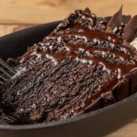 Decadent Chocolate Cake · Chocolate cake, filled with rich milk chocolate ganache, topped with whipped cream, chocolat...