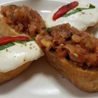 Bruschetta · 4 pieces are included. Toasted bread topped with chopped tomatoes, marinated with olive oil,...