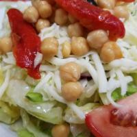 Italian Salad · Lettuce, tomatoes, onions, cucumbers, garbanzo beans, roasted peppers and mozzarella cheese ...