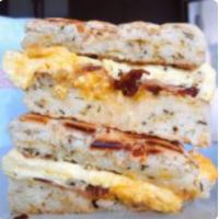 Bacon Egg & Cheese · Scrambled egg with medium cheddar and real pork bacon on your choice of house-baked bread or...