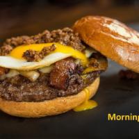 The Morning Joe  · Our 1/3 lb. burger topped with a fried egg, cheese, crispy bacon,  grilled onion and a splas...