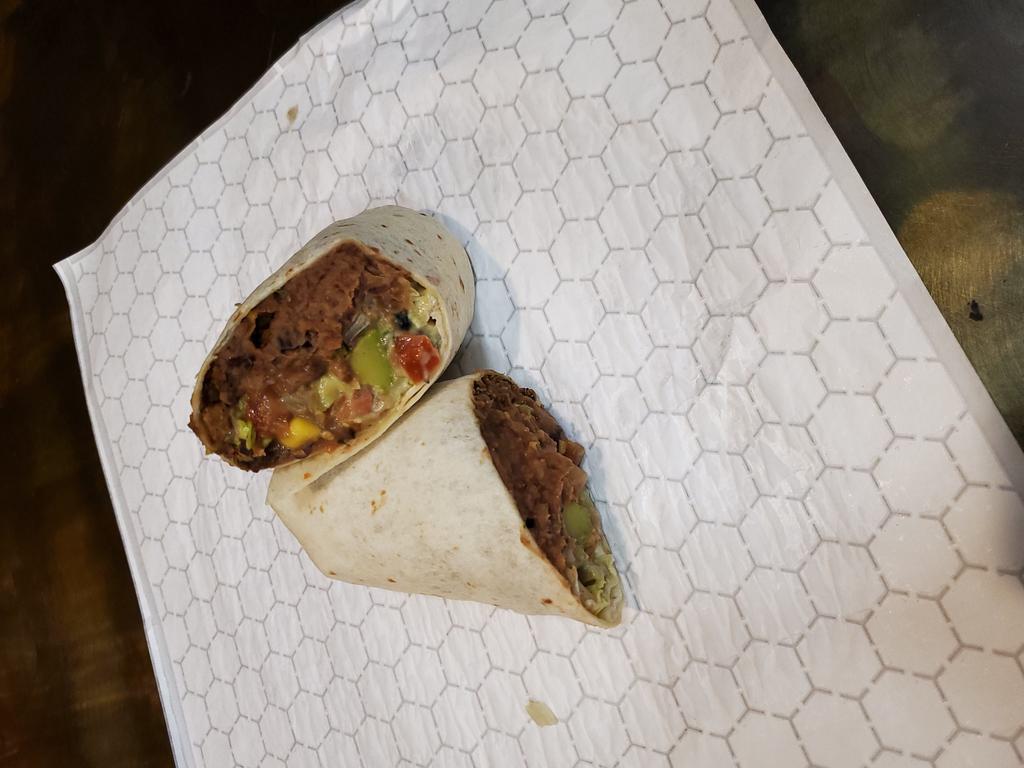 Josè Veggè · Our vegetarian-friendly burrito stuffed with or own homemade veggie burger, black beans and corn salsa, refried beans, guacamole, lettuce, tomato, olives and our homemade avocado cream.