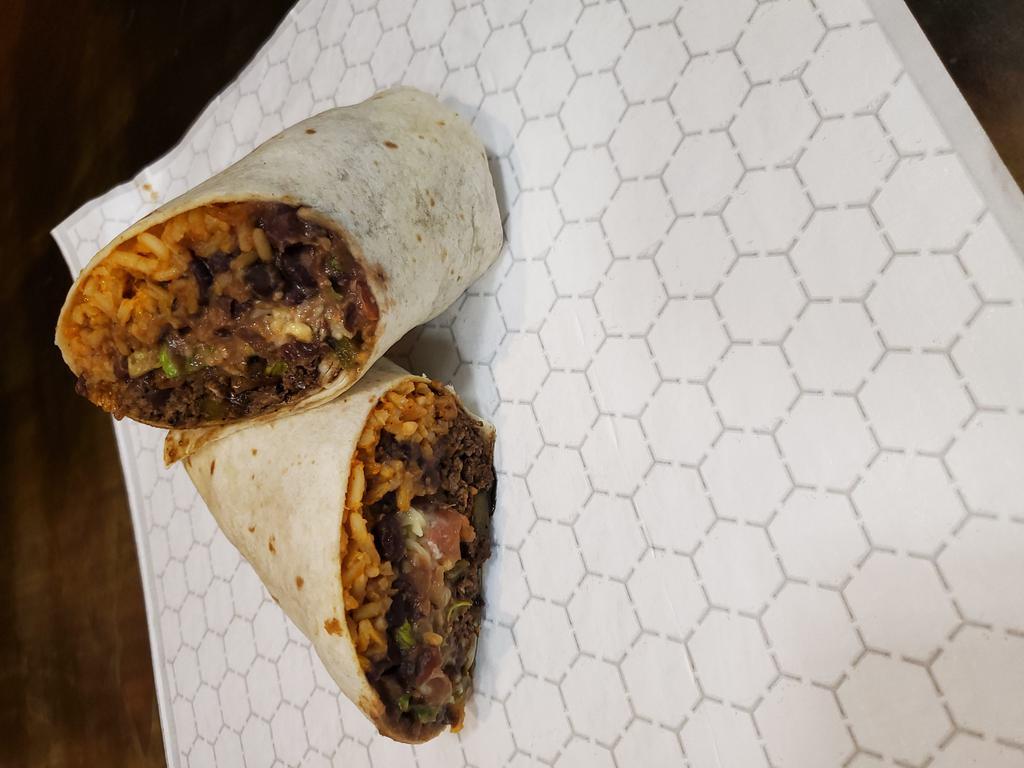 Josè Carne  · Our steak burrito with sauteed peppers and onions, quesadilla cheese, black beans, rice, lettuce, tomato and our homemade avocado cream.