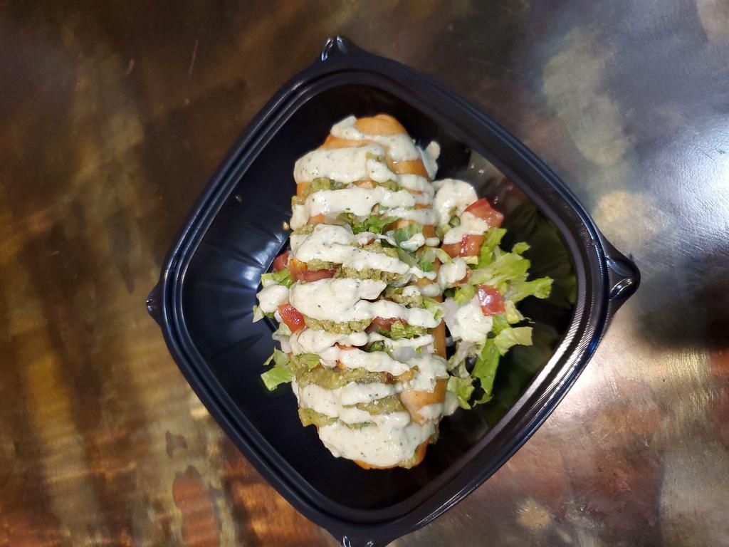Josè Fritto · Our big burrito stuffed with marinated chicken, black beans, rice and quesadilla cheese, then fried and topped with lettuce, tomato, mild salsa verde and our homemade avocado cream.