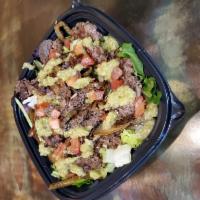 Steak Fajita Salad · Marinated steak with sauteed peppers and onions, tomatoes & mild salsa verde on a bed mixed ...