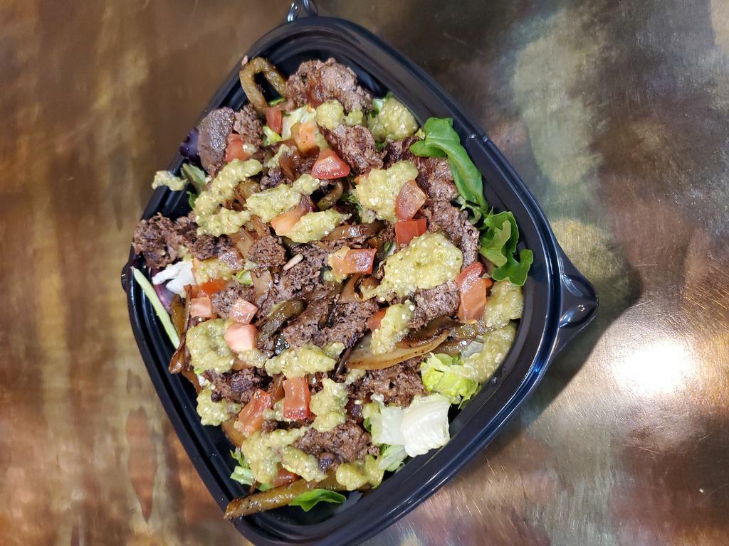 Steak Fajita Salad · Marinated steak with sauteed peppers and onions, tomatoes & mild salsa verde on a bed mixed greens. Served with a salsa ranch dressing.