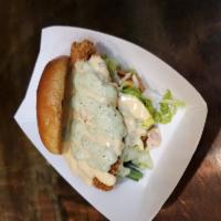 Nacho Crusted Chicken Sandwich · Nacho crusted chicken on a brioche roll topped with nacho cheese sauce, lettuce, tomatoes an...