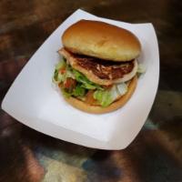 Marinated Chicken Sandwich · Marinated chicken grilled and served simply with lettuce and tomatoes on a buttery brioche r...