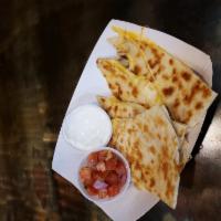 Kid's Chicken Quesadilla Meal · Kid sized chicken quesadilla plus any side and fountain drink or milk (chocolate or regular).