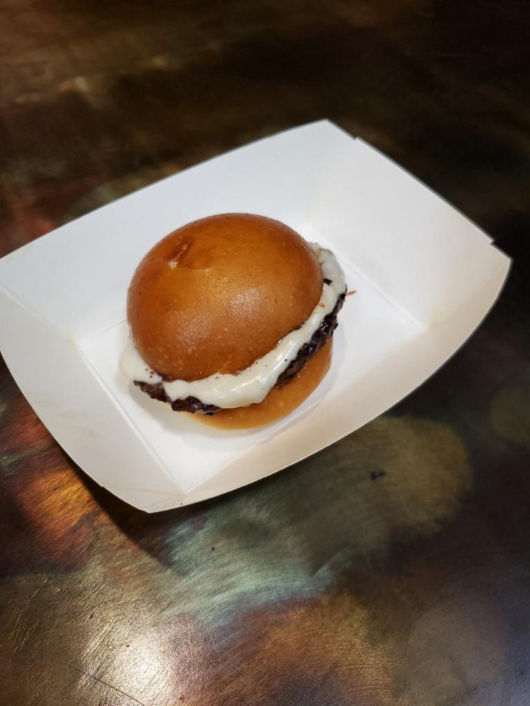 Kid's Burger Meal · Kid size burger on a buttery brioche roll plus any side and a fountain drink or milk (chocolate or regular). 