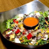 Super Grain Salad · Fresh spinach and arugula, tri-color quinoa, roasted veggies, dried cranberries, toasted alm...