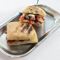 Gaucho - Chicken · Pulled Chicken, roasted peppers, mushroom, and onions.  With queso fresco on a ciabatta roll.