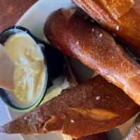 Bavarian Hot Pretzel · served with house-made cheese sauce