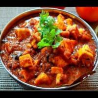 Kadai Paneer · A semi-dry and colorful dish of homemade cottage cheese cooked in an Indian wok with green b...