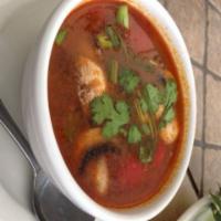 Tom Yum Soup · Hot and sour. Spicy and sour soup with fresh mushroom, tomatoes, peppers, and onion. Availab...