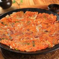 Kimchi Jeon · Korean pancake with diced Kimchi and vegetables. Spicy.