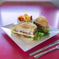 Turkey Club · Bacon, lettuce and tomato, choice of 3 slices of toasted bread.