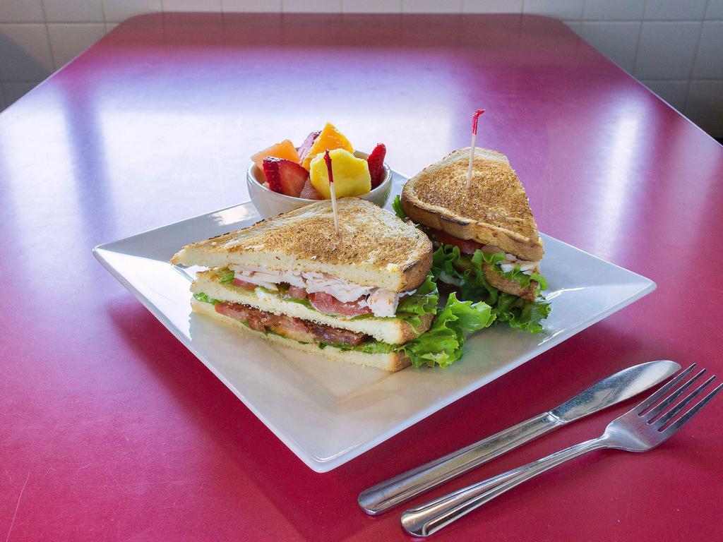 Turkey Club · Bacon, lettuce and tomato, choice of 3 slices of toasted bread.