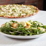 Lemon Arugula Salad · Arugula, shaved Italian cheese, coal oven baked croutons and lemon vinaigrette garnished with lemon wedges. Add fresh mozzarella, Genoa salami or grilled chicken for an extra charge.