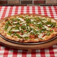 Prosciutto Arugula Pizza · Our classic white pizza topped with thinly sliced prosciutto, shaved cheese blend and fresh ...