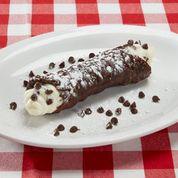 Chocolate Cannoli · Crispy, rolled, fried pastry shell dipped in chocolate and filled with sweet ricotta cheese and chocolate chips, finished with powdered sugar and more chocolate chips.
