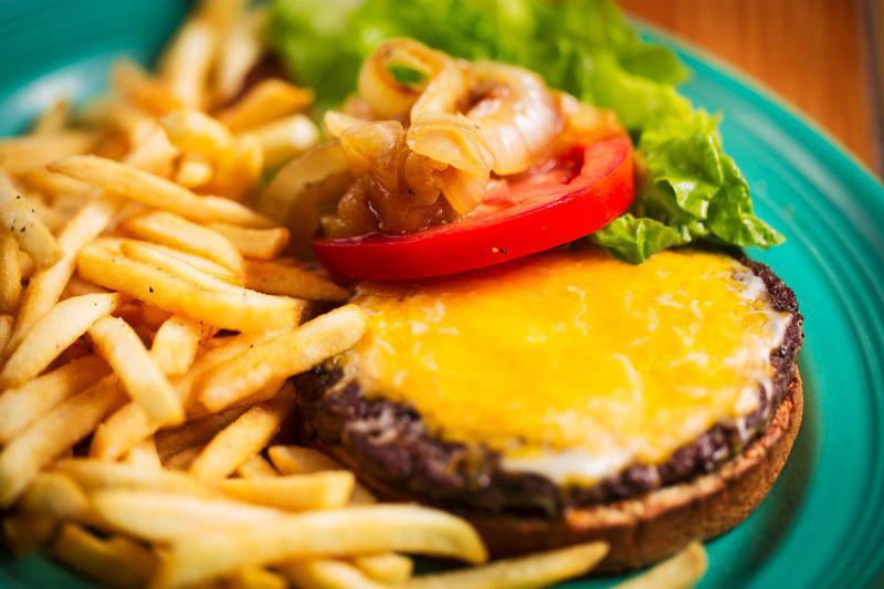 Cheeseburger · Served with French fries, tomato, lettuce, pickles and grilled onions.