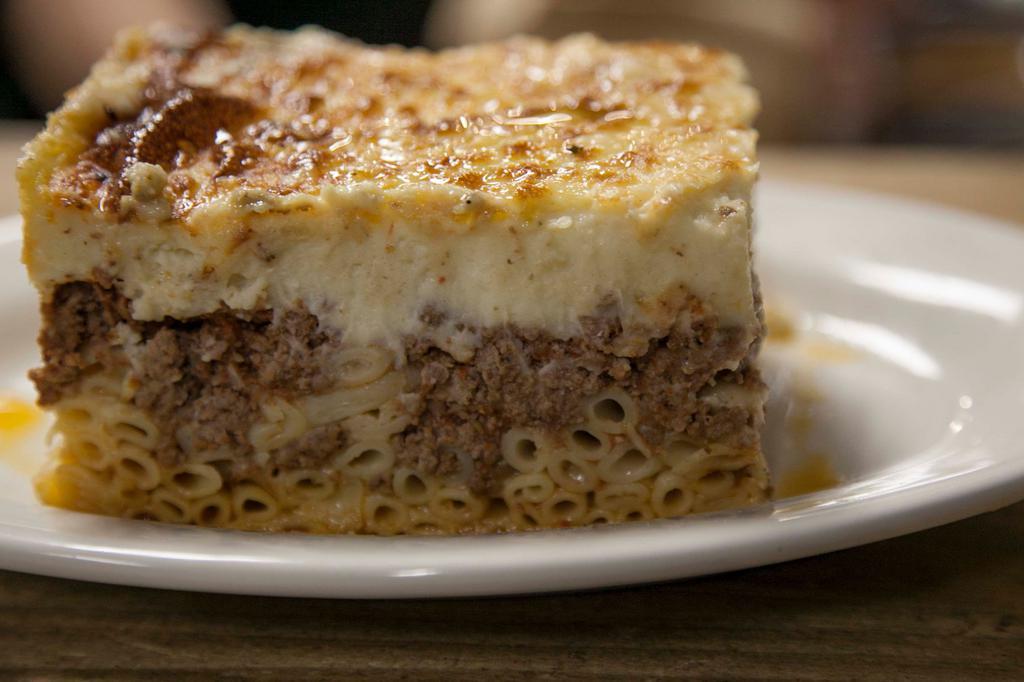 Pastitsio · Traditional baked pasta with bechamel sauce and ground beef.