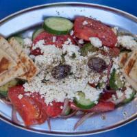 Horiatiki Salate · Greek salad. Tomato, cucumber, red onion, feta and Kalamata olives.