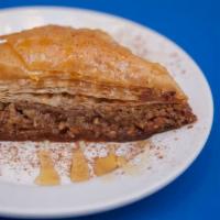 Baklava · Layered pastry filled with crunchy walnuts, honey and syrup.