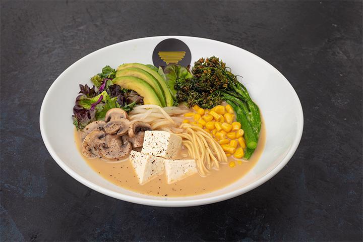 The Veggie Ramen · Vegetable broth with a miso base, bean sprouts, corn, mushroom, tofu, broccolini, baby greens, kale, red cabbage, and avocado.