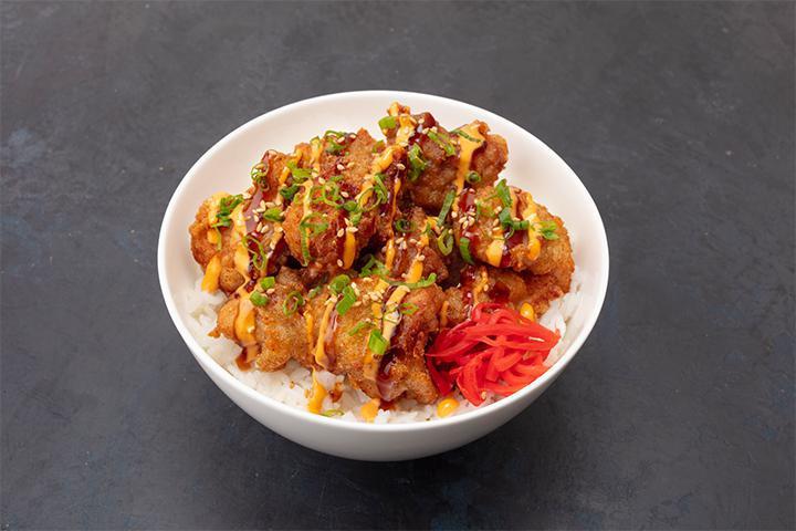 Chicken Karaage Bowl · Japanese style fried chicken, teriyaki sauce, spicy aioli, red ginger, and green onion.