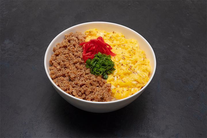 Soboro Bowl · Ground chicken with scrambled egg, red ginger, and green onion over rice.