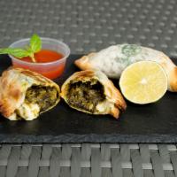 Spinach and Cheese Empanada · Spinach, mozzarella, onion, red bell pepper and seasoning.