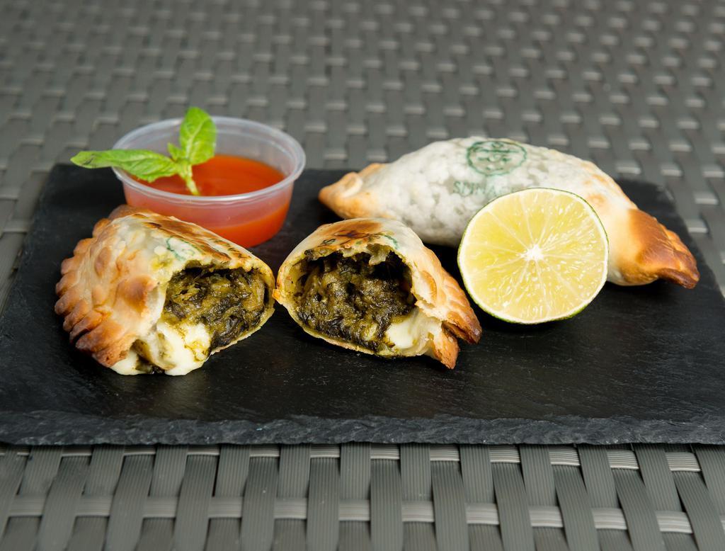 Spinach and Cheese Empanada · Spinach, mozzarella, onion, red bell pepper and seasoning.