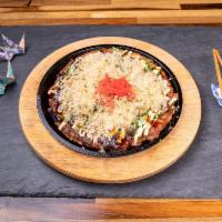 Okonomiyaki · Japanese Pancake ( Cabbage, onions, carrots, shrimp, mayo, scallions, bonito,  and pickle gi...