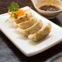 Gyoza · Meat and vegetable dumplings served steamed or pan fried.
