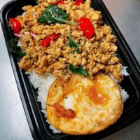Kao Ka Prow with Fried Egg · Fried egg and ground chicken stir-fried with Thai chili, garlic, bell peppers, and basil lea...