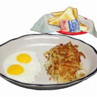 2 Eggs Breakfast · Two eggs cooked to order, hash browns and buttered toast with jelly.