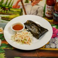 Tamale de Pollo · Chicken tamale wrapped in banana leaves and gently spiced. Stuffed with chicken and vegetabl...