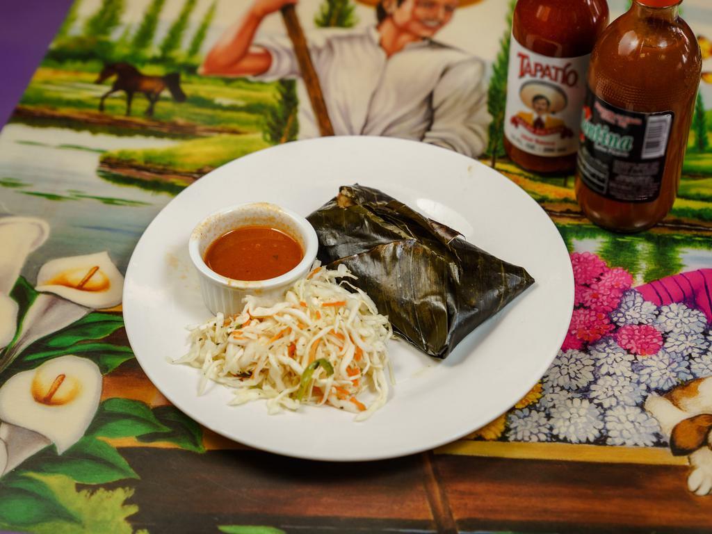 Tamale de Pollo · Chicken tamale wrapped in banana leaves and gently spiced. Stuffed with chicken and vegetables. Served with pickled cabbage salad and tomato sauce.