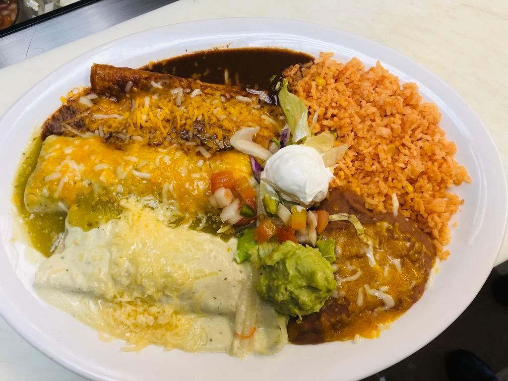 Tres Amigos Platter · For real enchilada lovers. 1 beef, 1 chicken and 1 cheese enchilada. Topped with 3 different sauces and cheddar cheese. Served with side of rice, beans and salad.